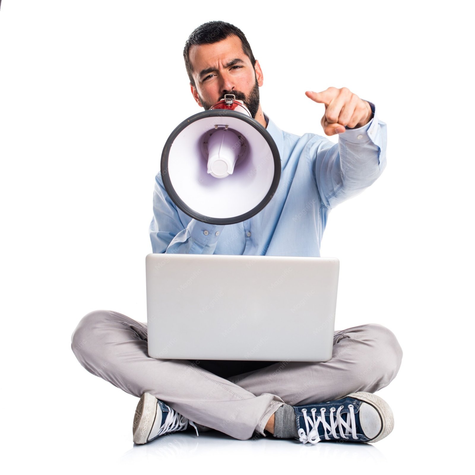 A man with a laptop shouting through a megaphone