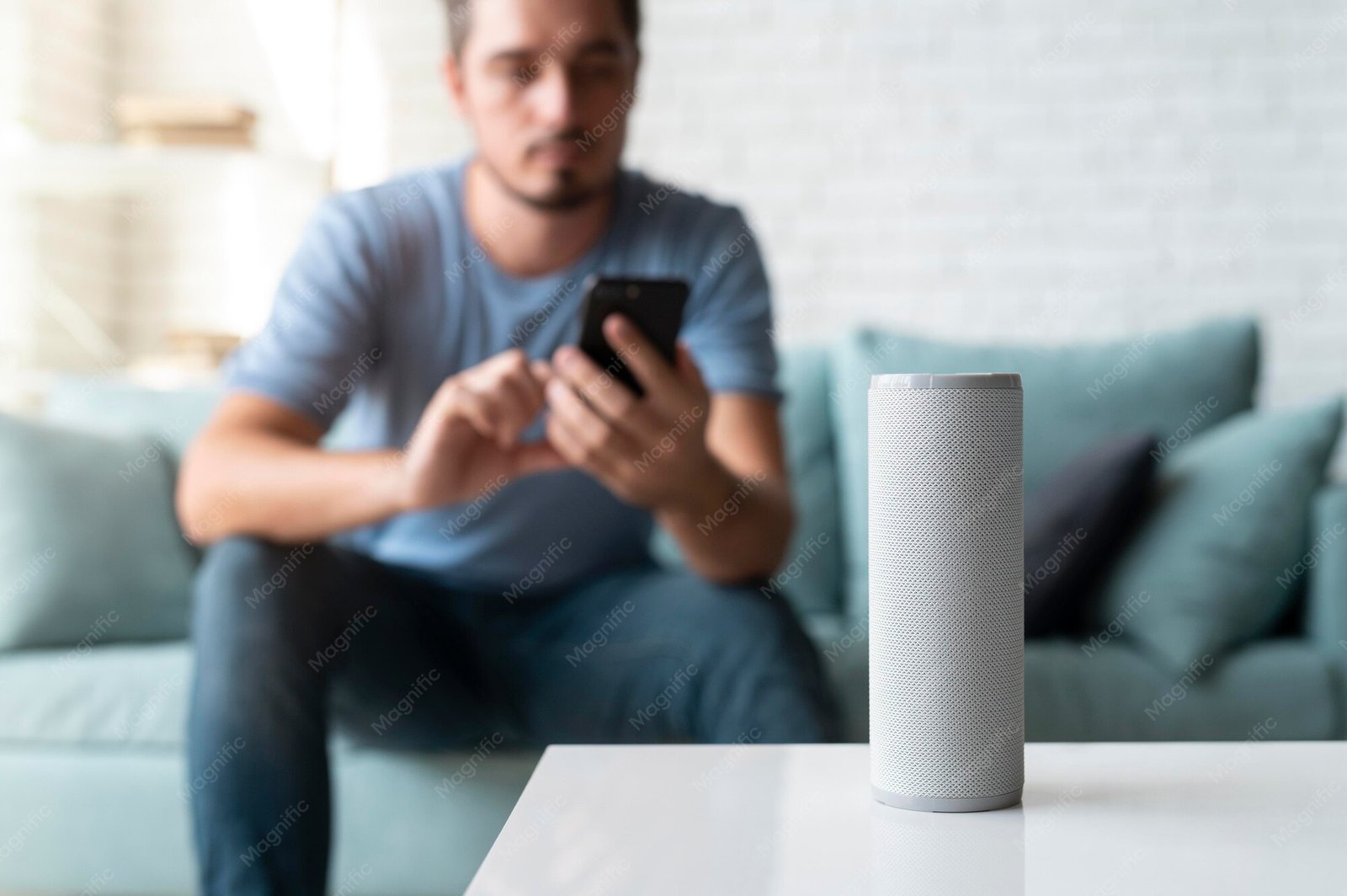 A man using a smart speaker with a voice assistant